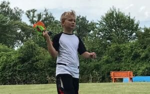 kid at camp with nerf gun